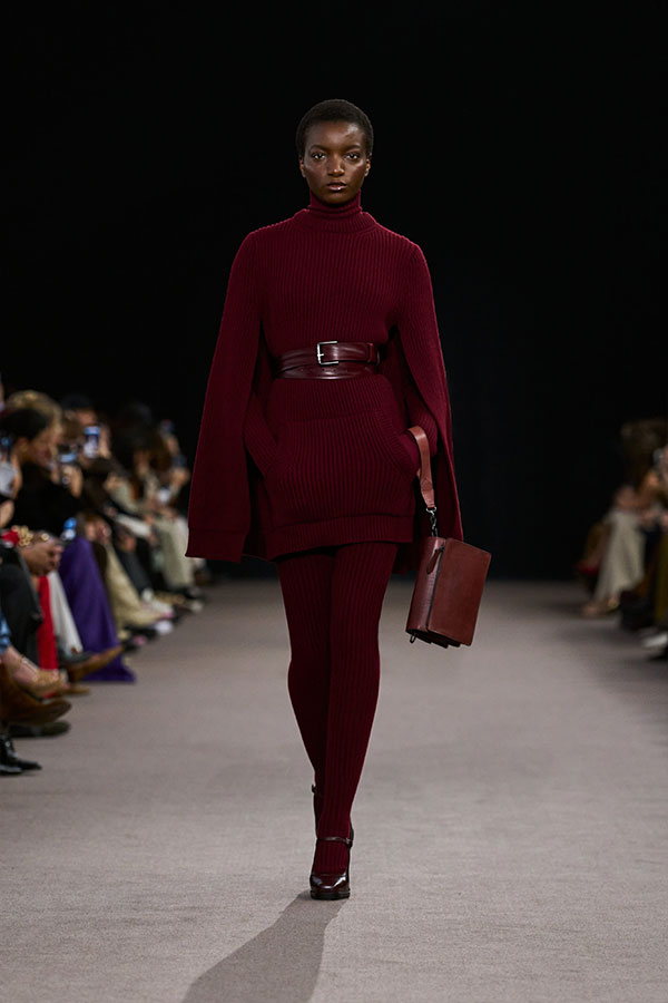 Max Mara Fall/Winter 2025 Fashion Show - Cherry Look with Cape Dress, Belt, Small Crossbody Bag and Mary Janes.